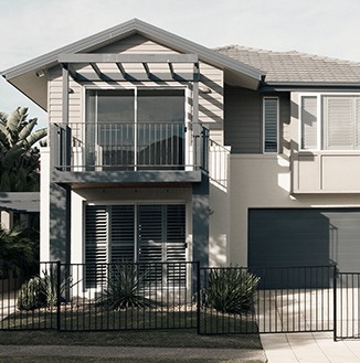 Modern two-story house with balcony and garden